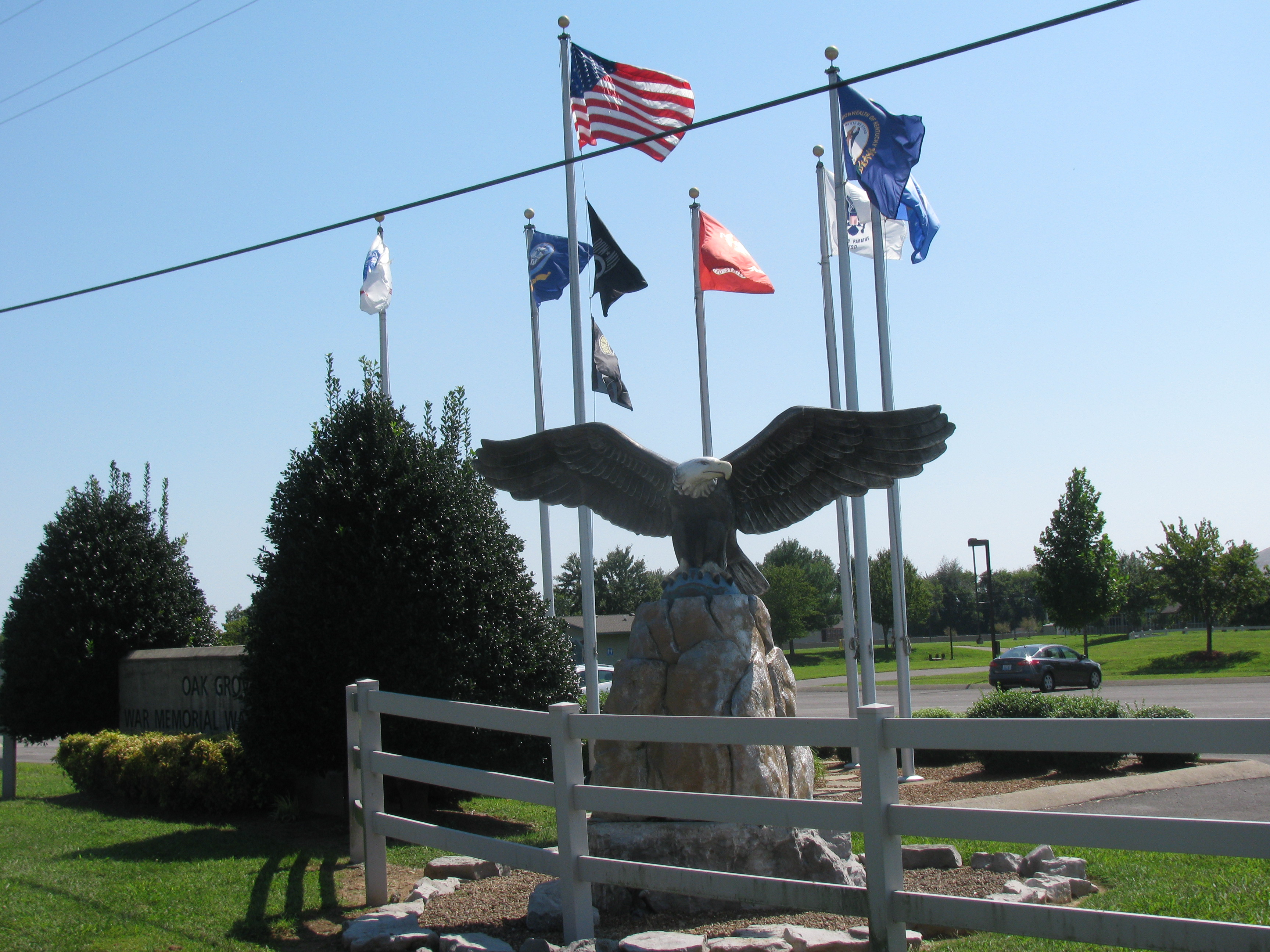 Oak Grove Kentucky War Memorial flags at entrance Mrs. HomeFree